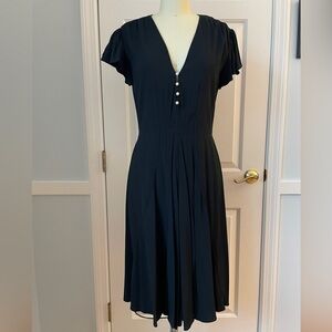 Altuzarra black dress with pearl buttons